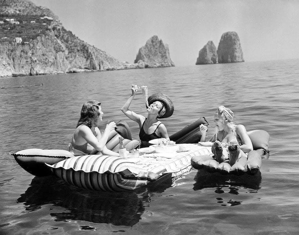 Friends sharing a meal on the water